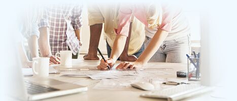Partners around desk